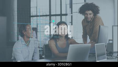 Working team in business wear leaning over laptops pointing at screen in modern office data overlay Stock Photo