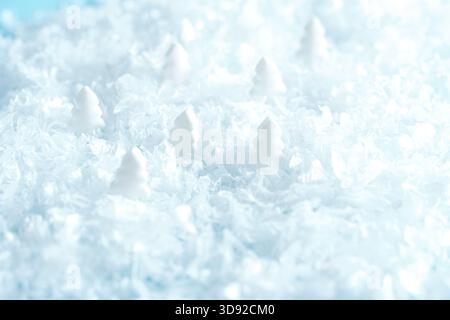 Close-up of icy snow with cold blue tones and crystal-like frozen formations. Blur and selective focus Stock Photo