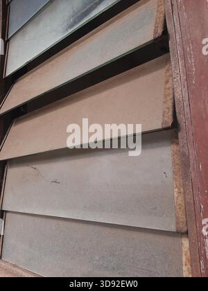 The window is covered with thick dust Stock Photo