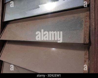 The window is covered with thick dust Stock Photo