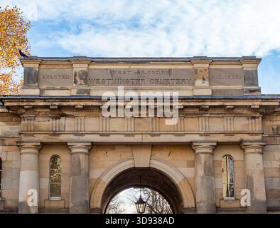 Detail of the inscription 'West of London and Westminster Cemetery' on the North Lodge entrance gate at Brompton Cemetery. Seen from Old Brompton Road. Stock Photo