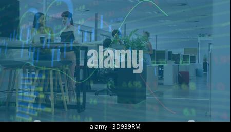 Talking colleagues in businesswear conversing at high table in office with paper cup stock overlay Stock Photo