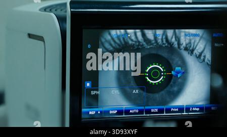 Close-up of a human eye being meticulously examined by advanced ophthalmology Stock Photo