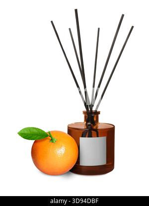 Citrus scented reed diffuser and fresh tangerine isolated on white Stock Photo