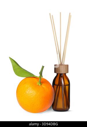 Citrus scented reed diffuser and fresh tangerine isolated on white Stock Photo