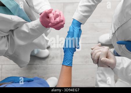 Doctors in medical gloves at clinic, top view Stock Photo