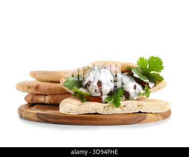 Wooden board of delicious pitas with falafel on white background Stock Photo