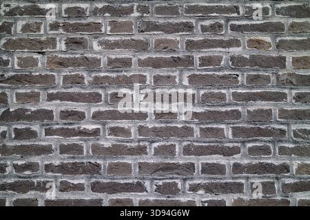 Full frame close-up on a black  brick wall. Stock Photo
