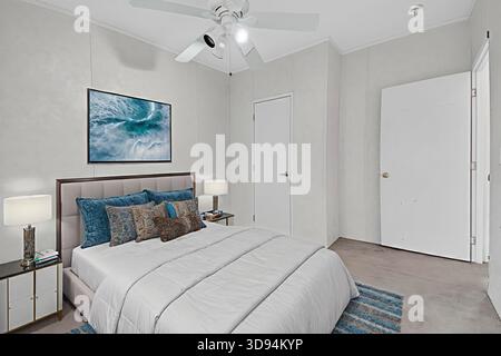 Peaceful Cozy Retreat, Tranquil Bedroom Decorated With Plush Linens And Seaside Artwork For Relaxation Stock Photo