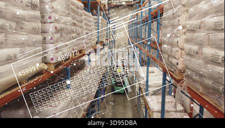 Showing sacks on racking in warehouse aisle, with HUD and worker in safety vest, hard hat Stock Photo