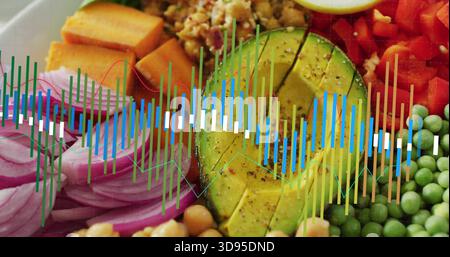 Showing composed bowl on tabletop, featuring halved avocado, red onion, sweet potato, waveform Stock Photo