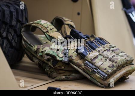Bucharest, Romania - December 1, 2025: Details with the military vest, ammo mags and gun of a Romanian soldier before the Romanian National Day milita Stock Photo