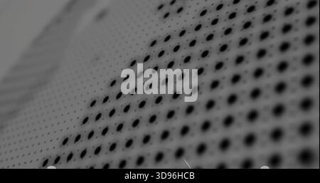 Showing perforated panel displaying diagonal holes at workbench, revealing matte finish scratches Stock Photo