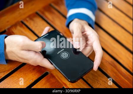 Chiang mai, Thailand - June 23rd, 2025: Close up of hand holding smartphone using Chatgpt application. Searching, Asking question , Chatting with AI. Stock Photo