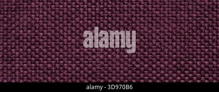 Dark purple woven textile macro texture background. Knitted wine fabric pattern for material design and backdrop. Stock Photo