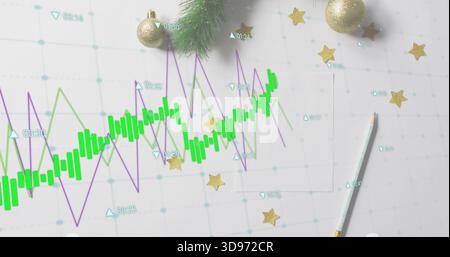 Displaying green candlestick chart and purple line graph on white grid paper, with gold baubles Stock Photo