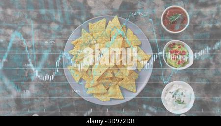 Displaying round plate with tortilla chips on wooden tabletop, showing three dips and market charts Stock Photo