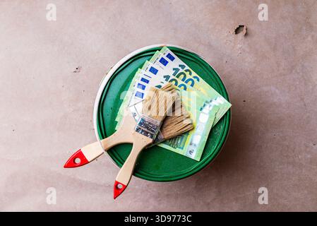 Bucket of paint with a brush on top. Top view. Stock Photo