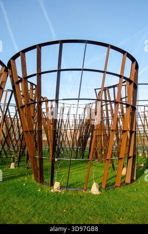 Dwaaltuin (Maze Garden) by Gijs Van Vaerenbergh, a Cor-Ten steel labyrinth sculpture, in a park in Heverlee, Leuven, Belgium Stock Photo