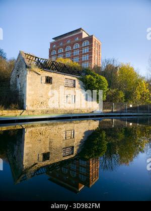 Derelict Stone Cottage and Red-Brick Mill Reflection on Calm Canal – Autumn Cotswolds England Uk Stock Photo