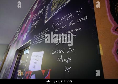 A tribute wall to Ozzy Osbourne at Birmingham Museum and Art Gallery, part of the Ozzy Osbourne: Working Class Hero exhibition, to mark what would have been the rock legend's 77th birthday. The wall consists of 77 messages chosen at random from over 50,000 tributes that were left by fans after Ozzy's death in the book of condolence hosted by the museum and at other sites across the city. Picture date: Thursday December 4, 2025. Stock Photo