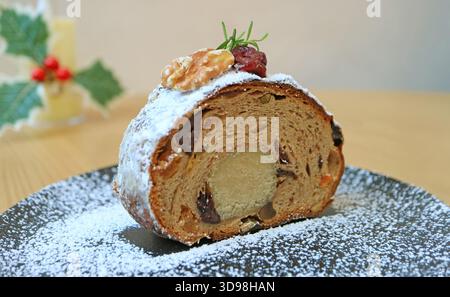 Closeup of a Slice of Stollen with Mouthwatering Marzipan in the Center of the Loaf Stock Photo