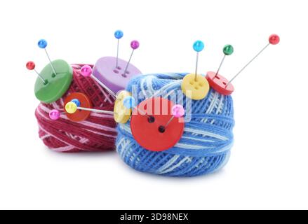 Balls of bright knitting yarn with buttons and pins isolated on white Stock Photo