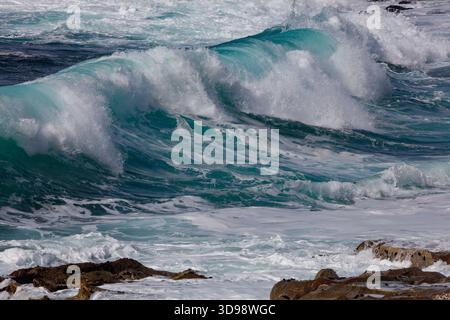 Crashing waves at Ribera beach along the California coast - Carmel Stock Photo