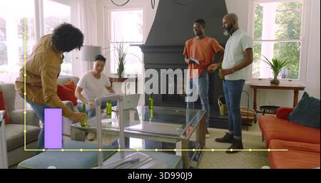 Leaning man tan-coat holding green beers at home while friends shifting near glass table, suitcase Stock Photo