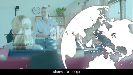 Teaching woman in blue shirt and jeans speaking at front of class, with whiteboard, globe overlay Stock Photo