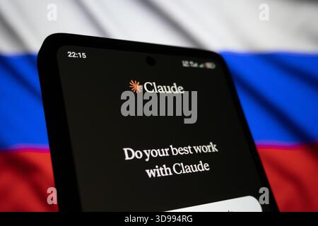 Claude app interface with background of Russia flag.Editorial photo has been captured: Baku, Azerbaijan. 29.11.2025. Stock Photo