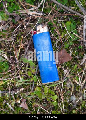 Bic disposable lighter on the grass, close up Stock Photo