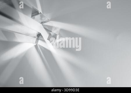 Glass prisms and cubes with rays. Abstract background with reflection and refraction of light. Shadow and rays of natural light effects. Color of the Stock Photo