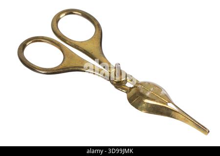 Antique brass candle candle wick trimmer scissors isolated on white background Stock Photo