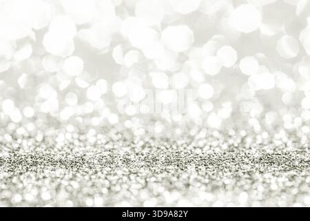 Silver glitter creating a festive abstract background with sparkling bokeh lights, suitable for holiday and celebration themes. Color of 2026 year dan Stock Photo