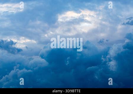 Dark blue clouds are gathering in the sky. Stock Photo