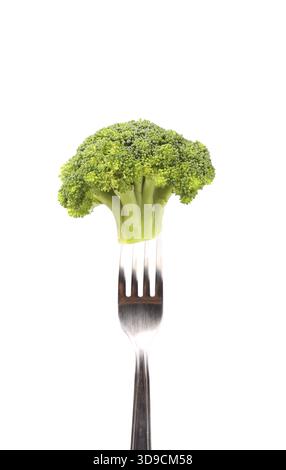 Broccoli impaled on a fork. White background Stock Photo