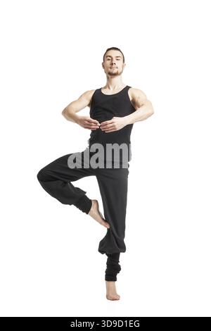 Black-haired man posing to camera in ballet stand.isolated Stock Photo
