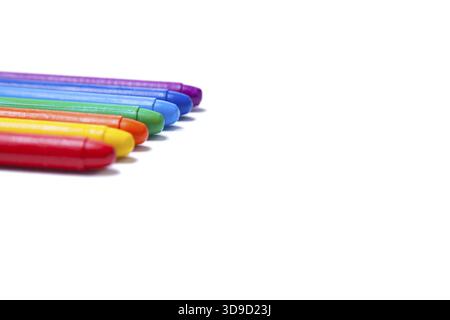 Crayons lined up in rainbow isolated on white background Stock Photo