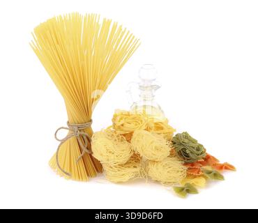 Different pasta and olive oil. White background Stock Photo