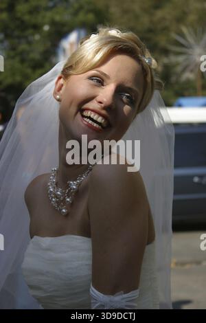 Beautiful smiles of the bride of the blonde. The happy Bride Stock Photo
