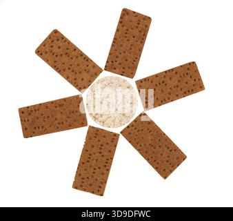 Composition of corn cracker and bread crisps. White background Stock Photo