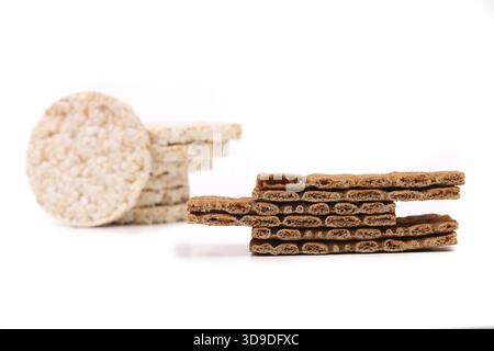 Composition of corn cracker and bread crisps. White background Stock Photo