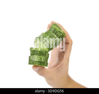 Hand holds stack juicy cucumber on a white background Stock Photo