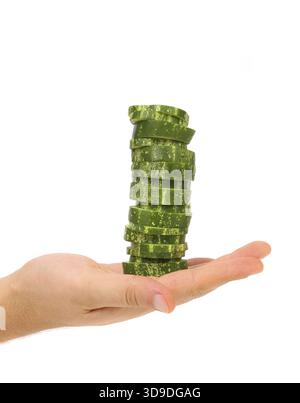 Hand holds stack juicy cucumber on a white background Stock Photo