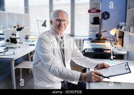 Portrait of Senior Caucasian Man Scientist Working in Laboratory Office Stock Photo