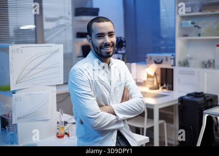 Portrait of Young Adult Man Smiling in Laboratory Setting Stock Photo