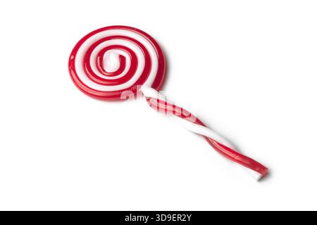 Red and white spiral lollipop on white background Stock Photo