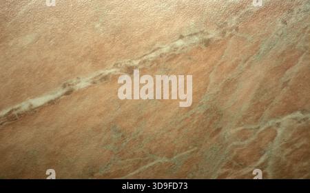 A close-up of pale pink onyx, featuring a pattern with white stripes and polished natural stone inclusions. Seamless background texture. Stock Photo
