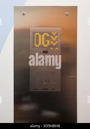 Kiel, Germany - 01. December 2025: Modern elevator control panel displaying the OGS floor, capacity information for people and weight, and control but Stock Photo